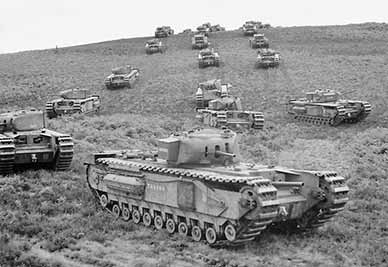 Churchill tanks of the 33rd Army Tank Brigade manoeuvre near Brockenhurst on 13 August 1942. (Image courtesy of the Imperial War Museum)